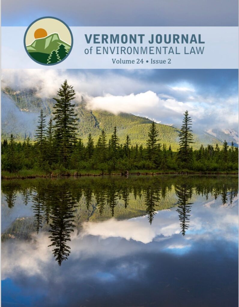 Volume 24 Issue 2 Cover featuring a lake with a mountain in the background